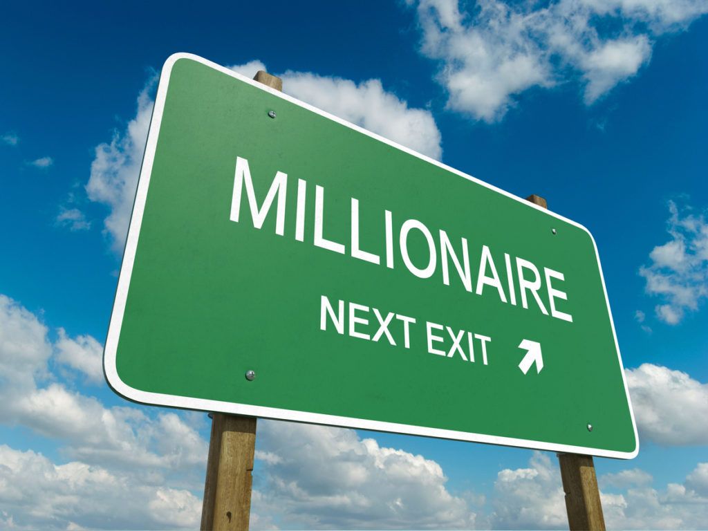 Wegweiser beschriftet mit dem Wort "Millionär"